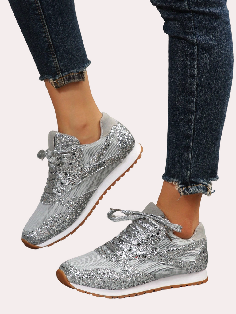 a pair of women's shoes with silver sequins