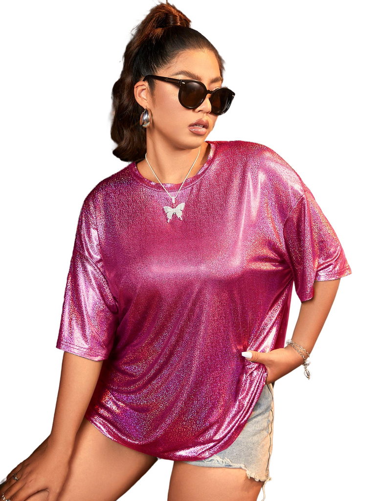 a woman wearing sunglasses and a pink top