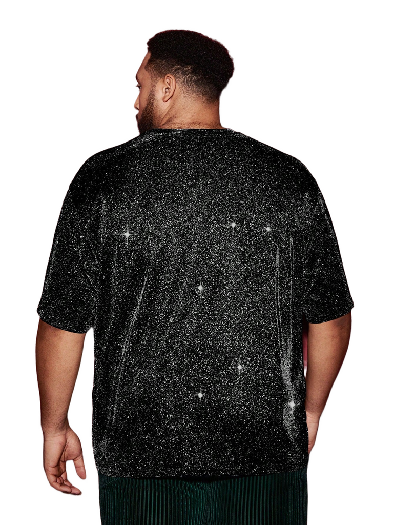 a man wearing a black t - shirt with stars on it