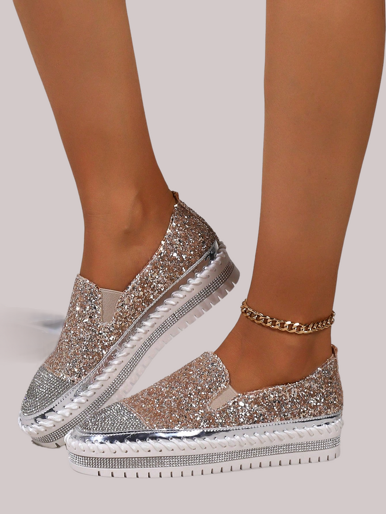 a close up of a person wearing glitter shoes